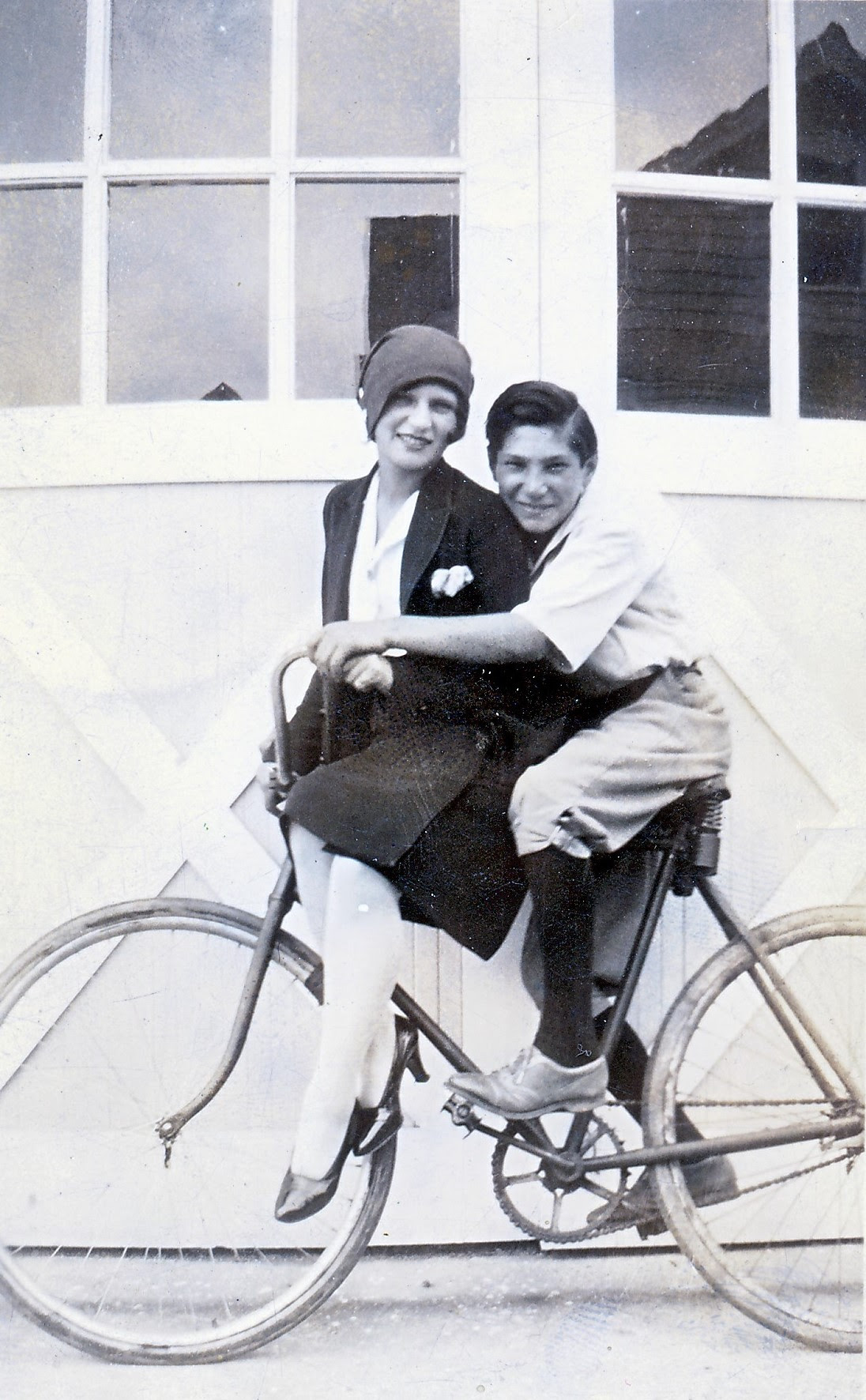 Benjamin (Bob) Goldberg giving Sadie Goldberg Kleinfeld a ride on his bike