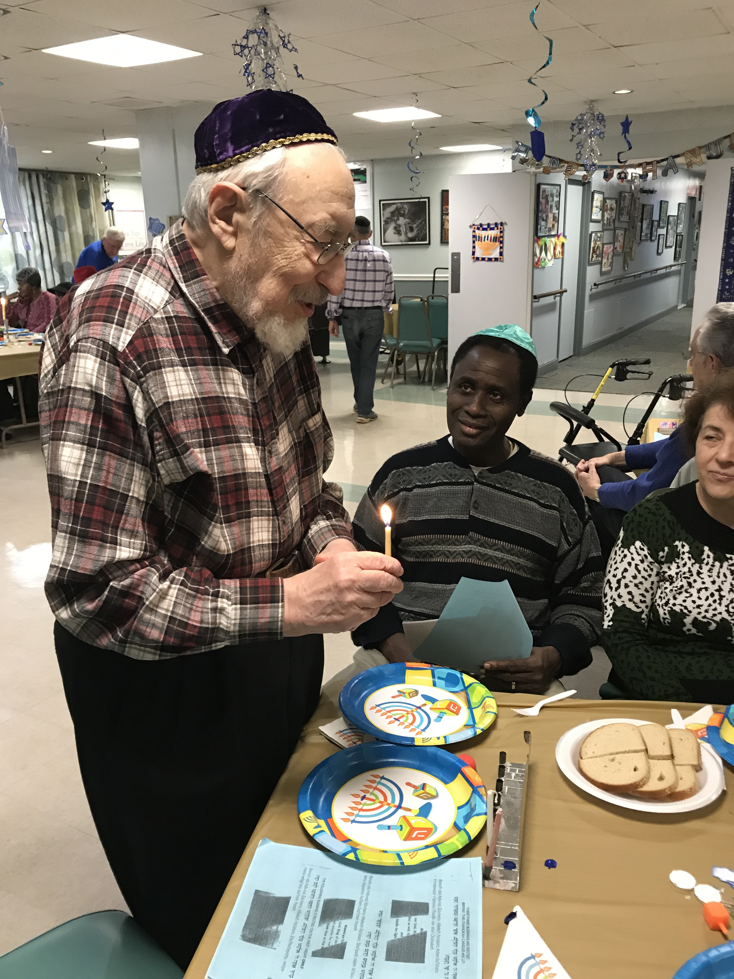 Hanukkah being celebrated at the Jewish Federation.