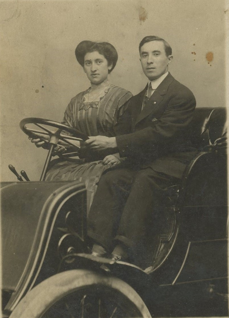 Well dressed couple in car