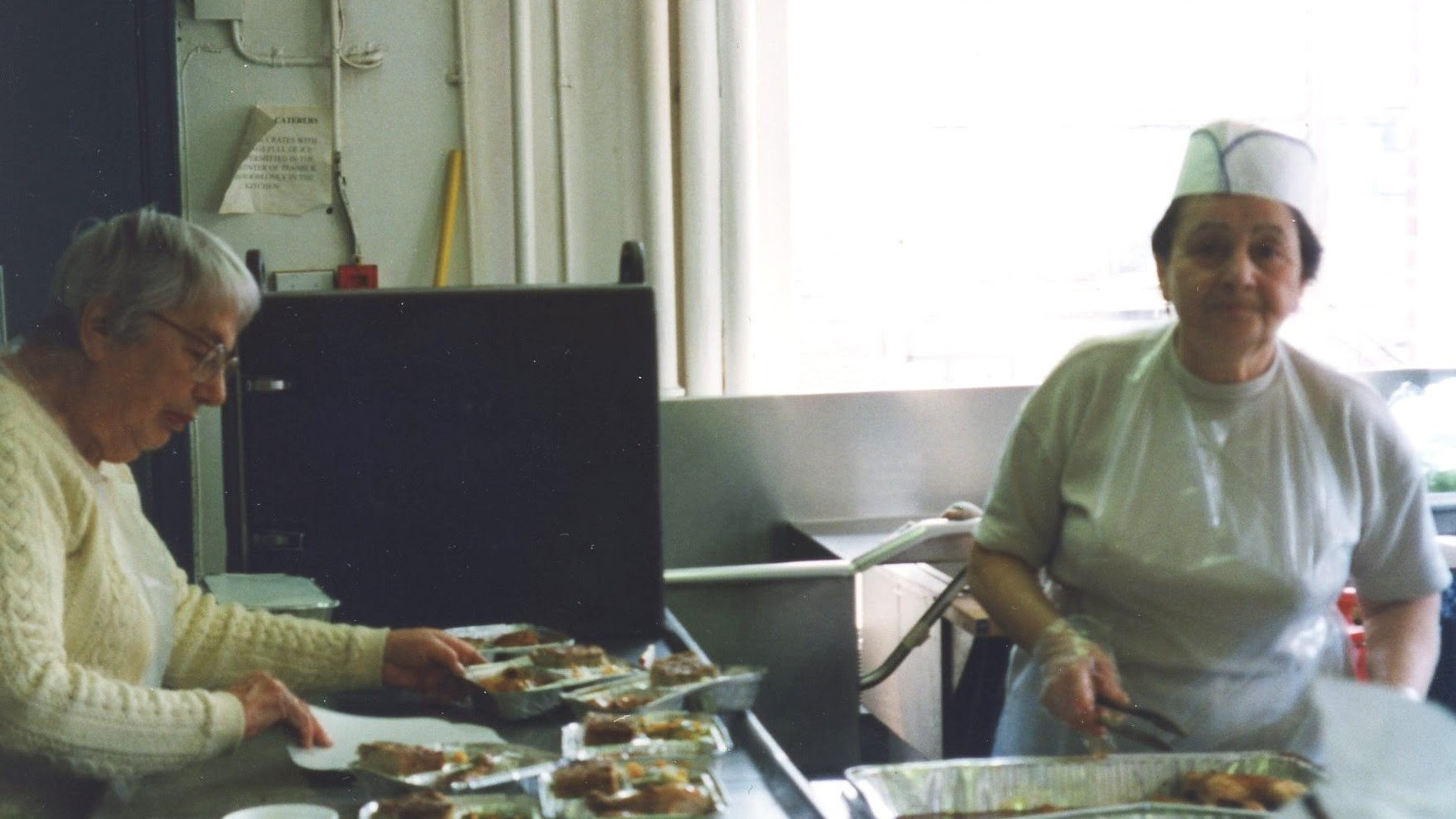 Volunteer preparing another hot meal