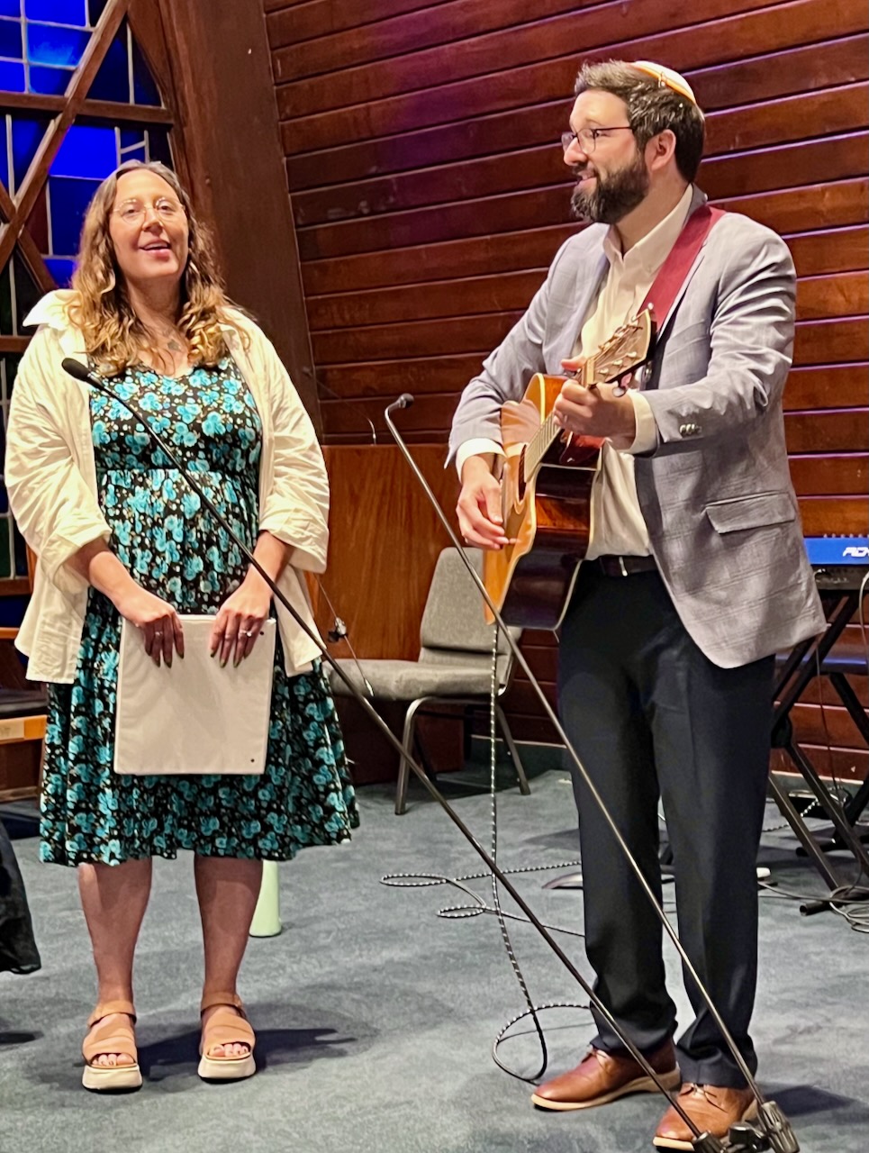 Rabbi Louis Polisson playing guitar